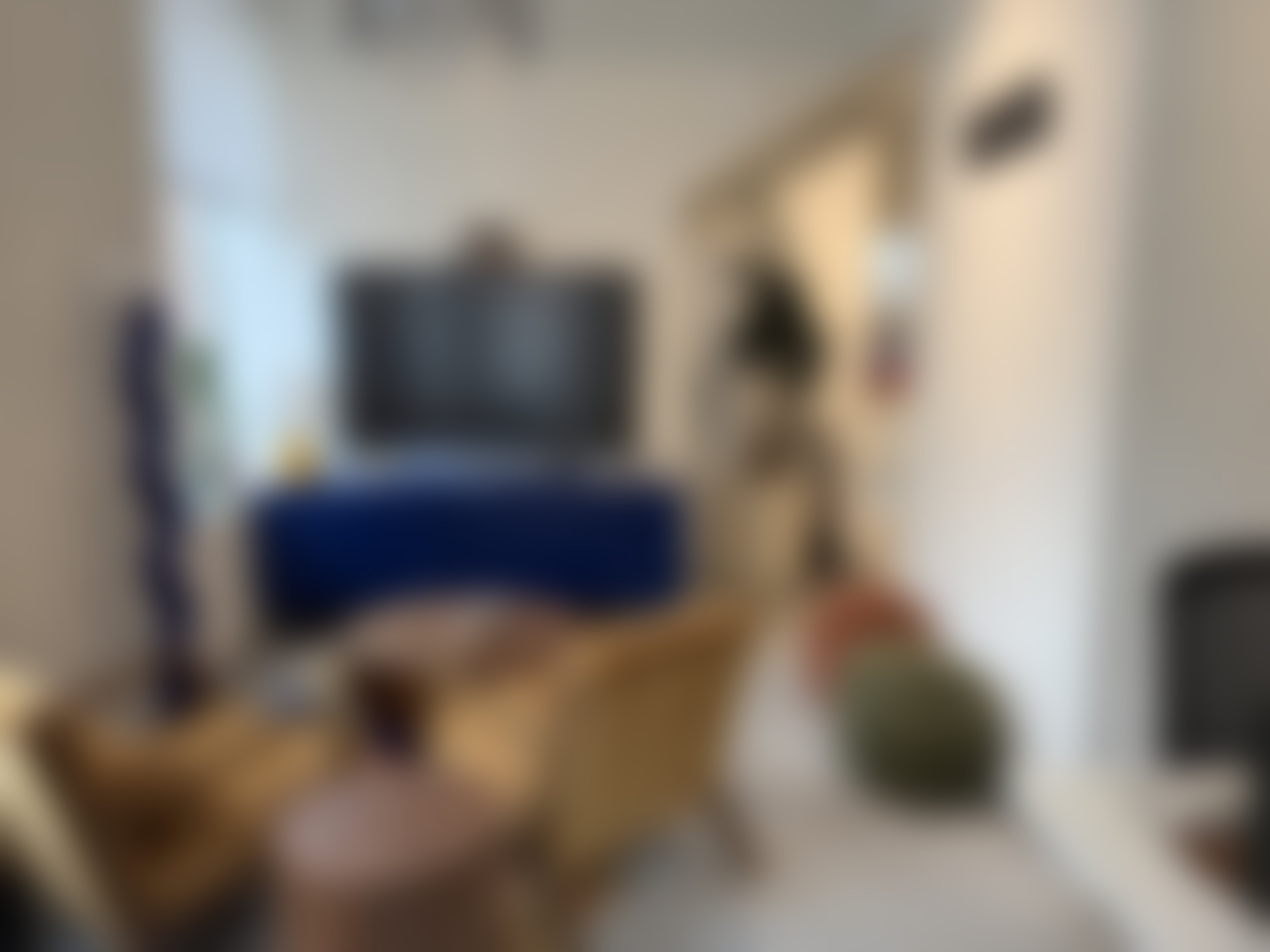 UUG.AI collaboration lounge with seating, a display, and natural light