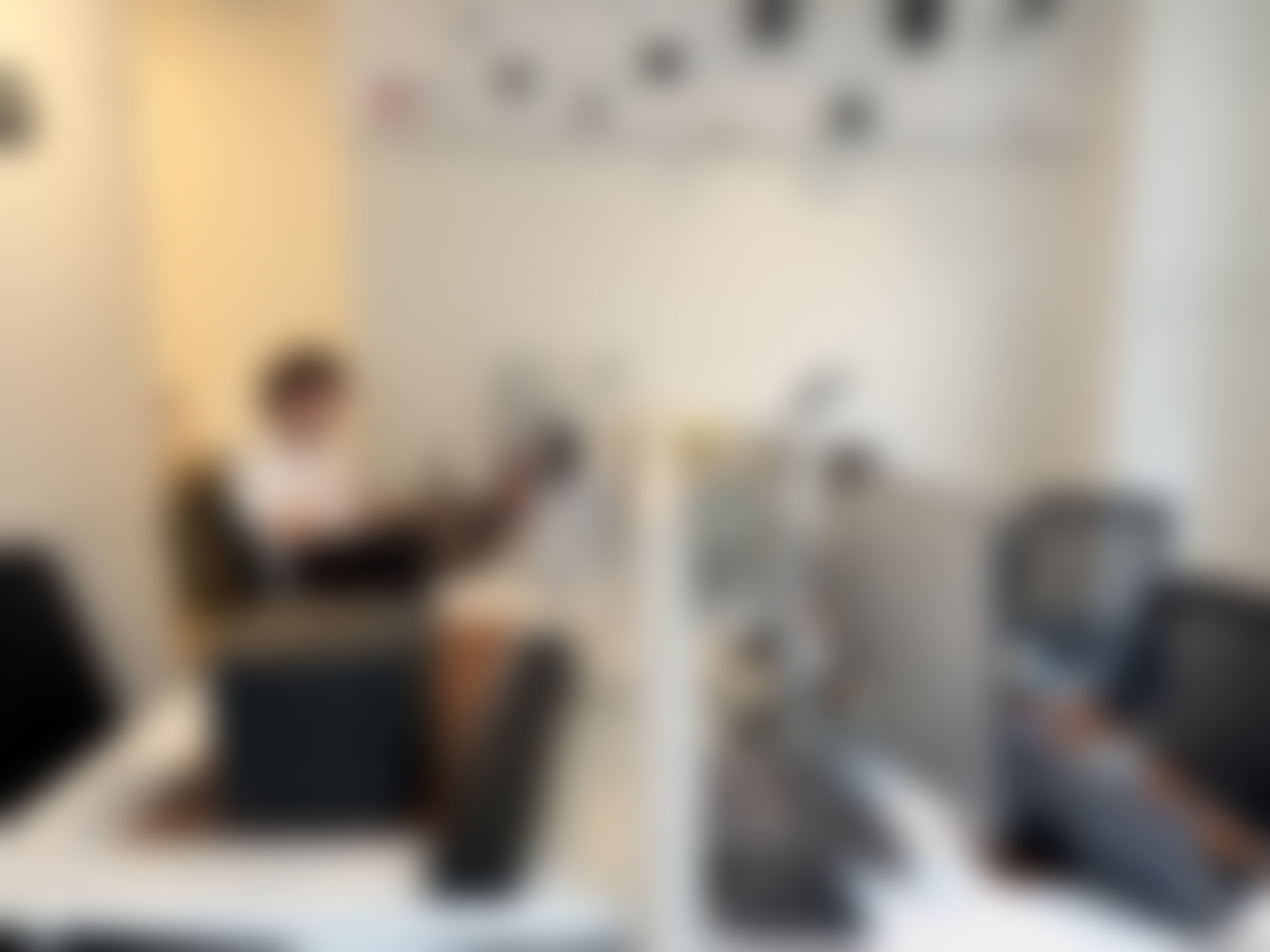 UUG.AI workspace with a team member and a wall of camera hardware